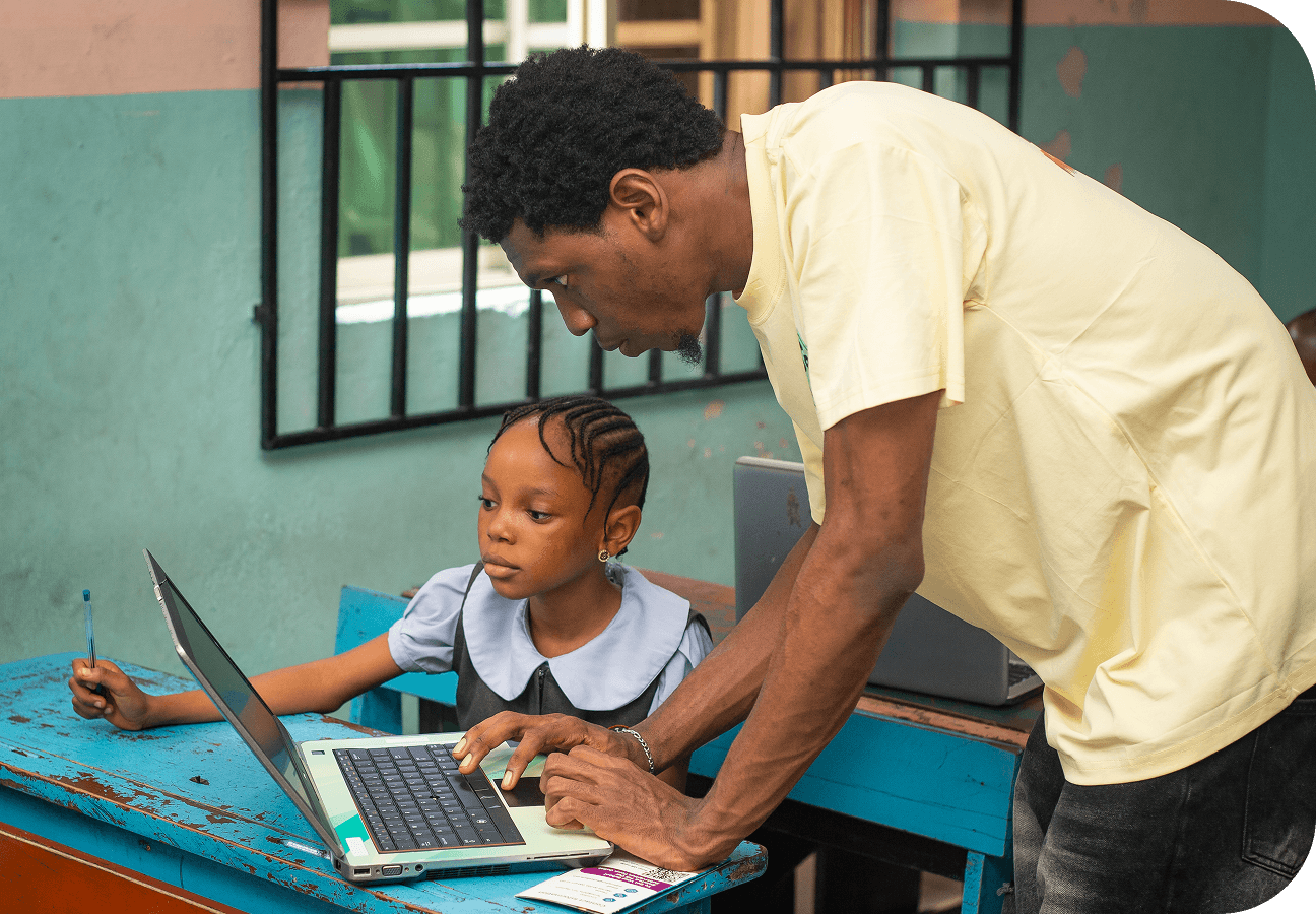 Kids coding on laptops